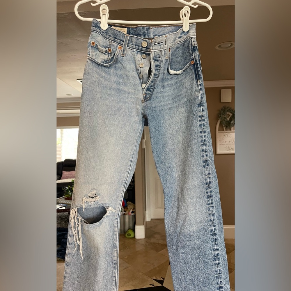 Levi’s ripped two tone denim jeans